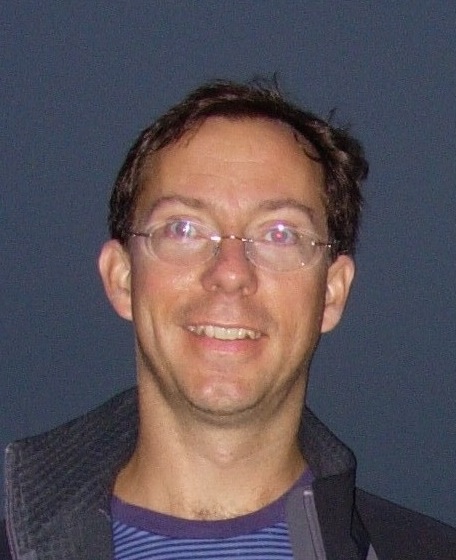 Portrait photo of Don Banfield in the field at night, a research scientist at NASA Ames.