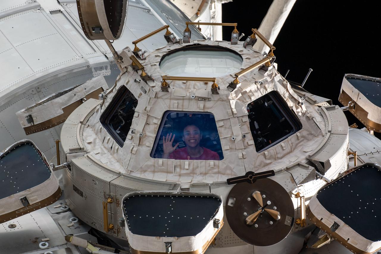 NASA astronaut Jessica Watkins is pictured looking out from the International Space Station's cupola window.