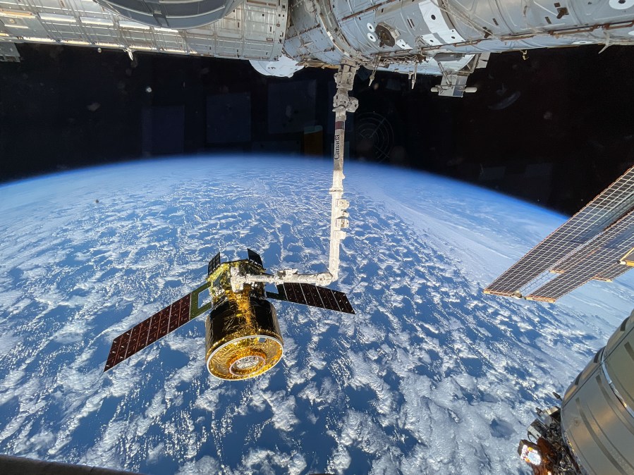 The new HTV-X1 cargo spacecraft from JAXA (Japan Aerospace Exploration Agency) is pictured in the grips of the Canadarm2 robotic arm after completing its arrival at the International Space Station on Oct. 29, 2025.