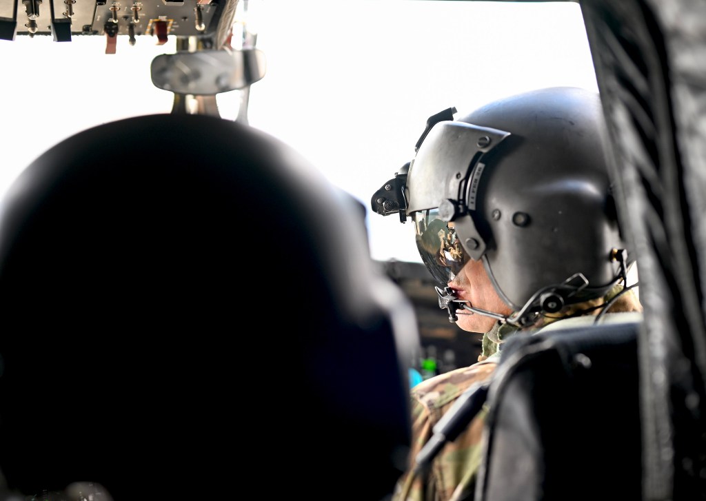 Colorado National Guard Chief Warrant Officer and military helicopter pilot Ethan Jacobs stands in the hangar bay at the High-Altitude Army National Guard Training Site near Gypsum, Colorado. NASA and the Colorado Army National Guard are partnering on a simulated lander flight training course for Artemis in the mountains of northern Colorado. Jacobs is the lead instructor and helped to develop the course.