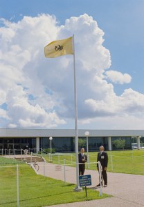 Dr. Charles A. Berry, Director, Medical Research and Operations, and Dr. Walter W. Kemmerer, Chief, Preventive Medicine Div., are pictured looking at the Quarantine Flag being flown outside the Bldg. 37 Lunar Receiving Laboratory where the Apollo 11 Astronauts are temporarily housed.