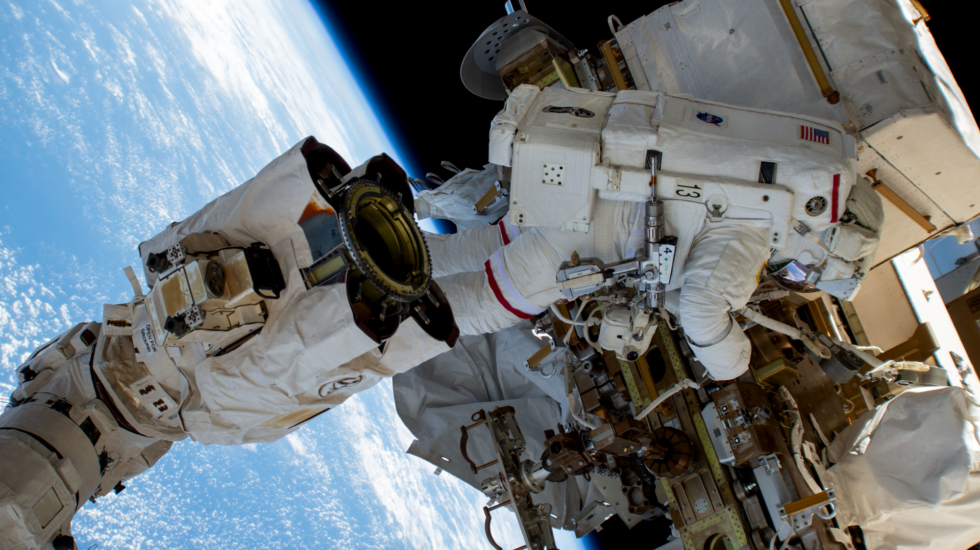 A NASA astronaut removes equipment outside the International Space Station on a spacewalk. Without proper safeguards, transitioning from inside the space station to inside a spacesuit at a lower pressure can cause decompression sickness in astronauts during spacewalks.