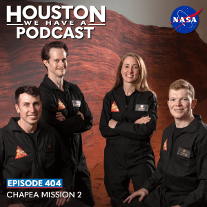 Houston We Have a Podcast Episode 404: CHAPEA Mission 2 Three men and a woman wear dark colored flight suits, posing on a simulated Mars landscape.
