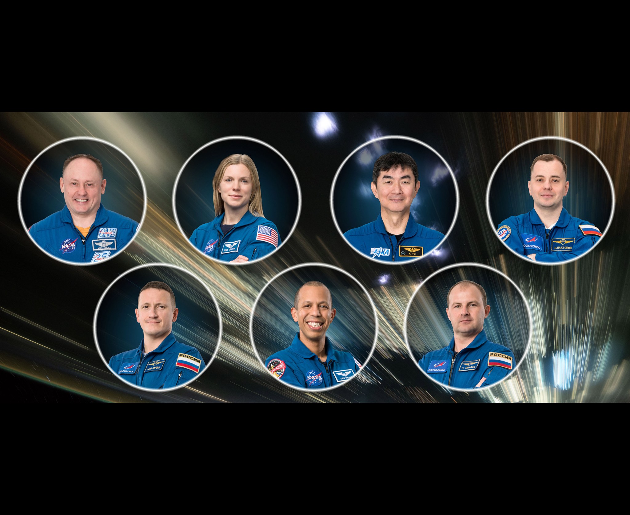 The official portrait of the Expedition 74 crew on the International Space Station. Top row from left, Commander Mike Fincke and Flight Engineer Zena Cardman, both NASA astronauts, JAXA (Japan Aerospace Exploration Agency) Flight Engineer Kimiya Yui, and Roscosmos Flight Engineer Oleg Platonov. Bottom row, Roscosmos Flight Engineer Sergey Kud-Sverchkov, NASA astronaut Chris Williams, and Roscosmos Flight Engineer Sergei Mikaev.