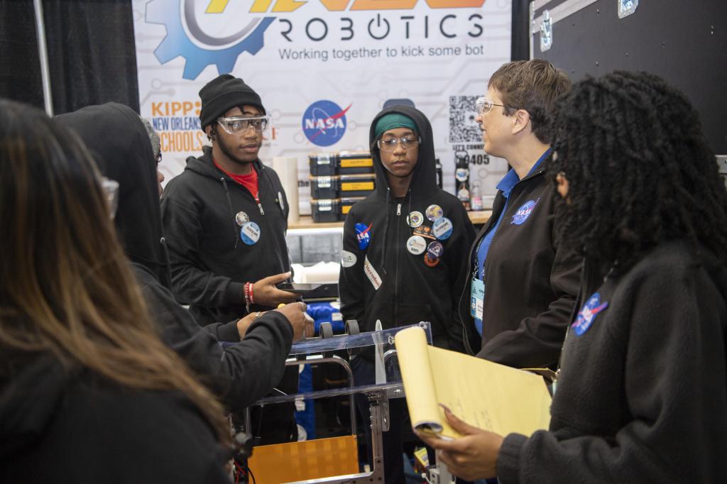 a team of FIRST Robotics competitors with Michele Beisler