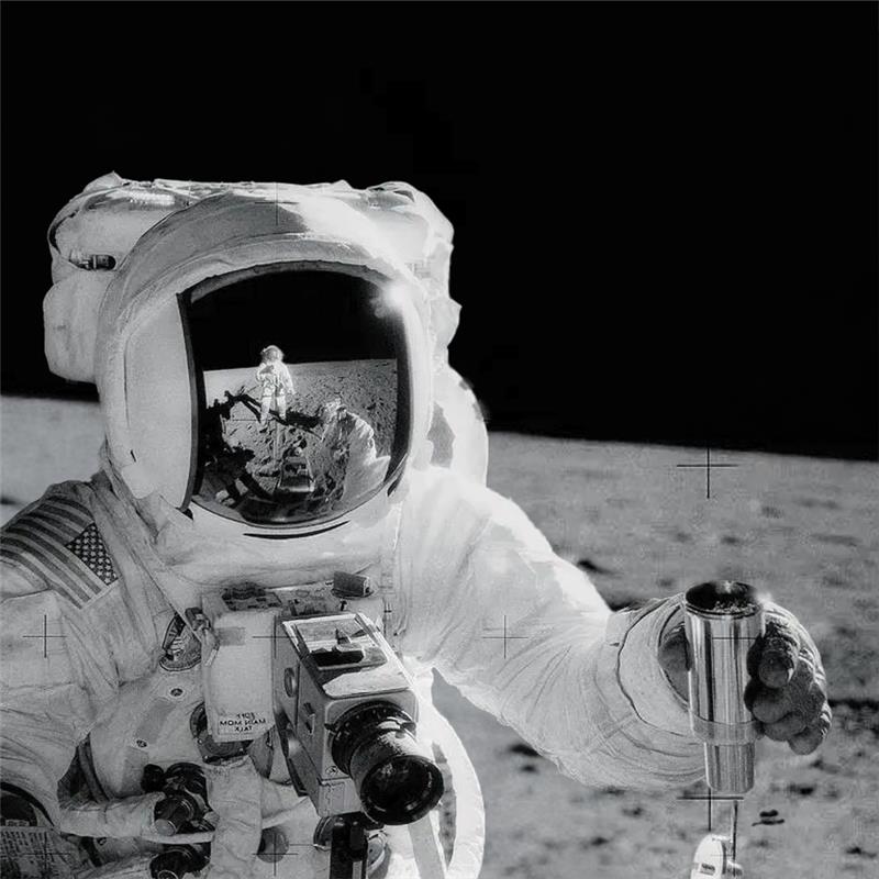 Spinoff 2026 marks the publication's 50th year documenting commercial uses of NASA technology. This edition’s cover features Astronaut Alan Bean holding an environmental sample container filled with lunar soil during the Apollo 12 mission of November 1969. Astronaut Charles Conrad Jr., who took this picture, is reflected in Bean’s helmet visor.