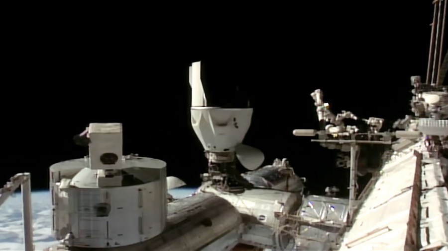 The SpaceX Dragon crew spacecraft with four Crew-11 members aboard is seen docked to the Harmony module's space-facing port on the International Space Station.
