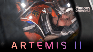 Close-up image of Reid Wiseman, Artemis II commander, wearing an orange spacesuit and clear helmet. The words "Artemis II" are across the bottom of the image and the Curious Universe logo is in the upper right corner.
