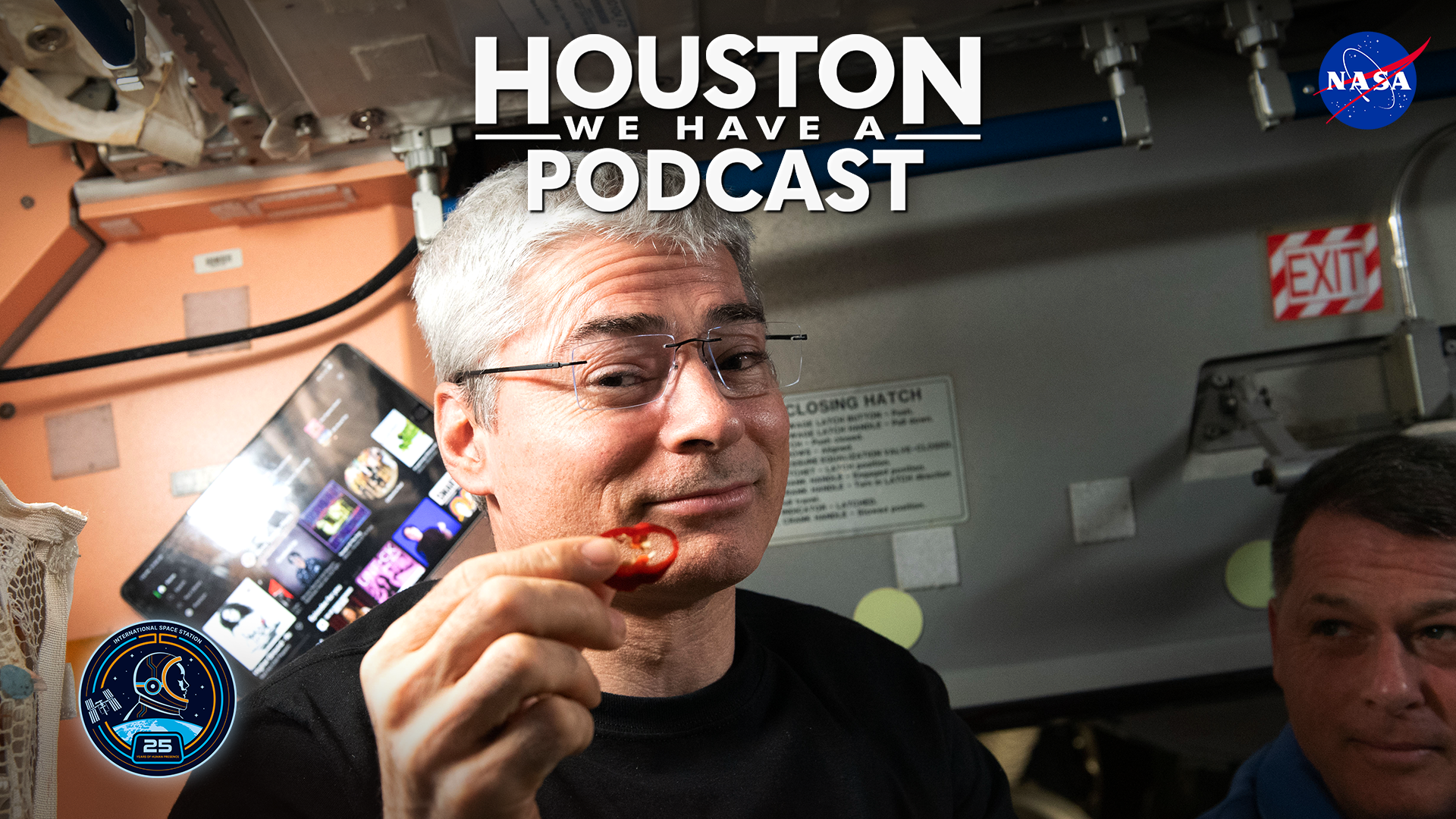 HWHAP Ep. 409. NASA Astronaut Mark Vande Hei holds up a slice of pepper grown on the International Space Station.