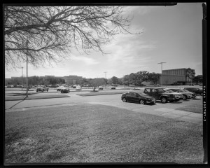 HAER-TX-109-N-12, South view from Building 31 front entrance and Cactus Garden towards JSC including Northeast corner of building 10 and North facing view of Building 7 high bay