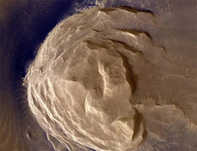 This image from NASA's Mars Reconnaissance Orbiter (MRO) shows blocks of layered terrain within the Olympus Mons aureole.