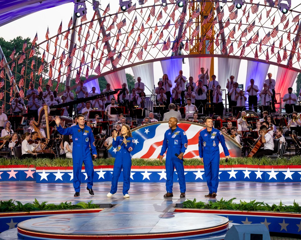 CSA (Canadian Space Agency) astronaut Jeremy Hansen, mission specialist; left, and NASA astronauts Christina Koch, mission specialist; Victor Glover, pilot; Reid Wiseman, commander; right, during the “A Capitol Fourth” concert, Saturday, July 4, 2026, on the National Mall in Washington, D.C.