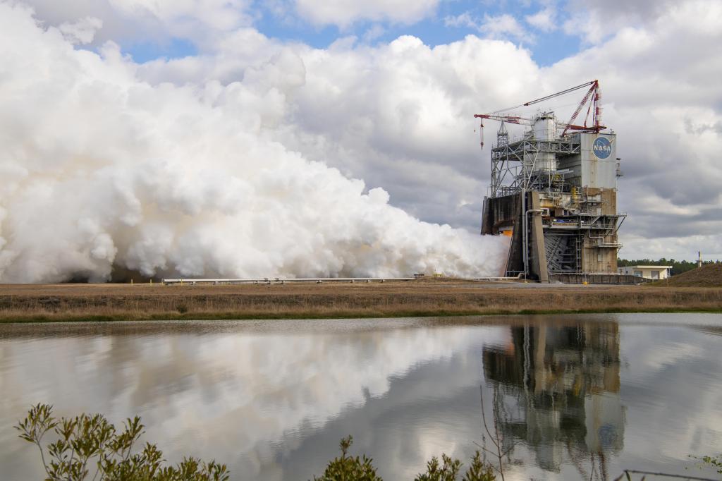 a closer look at vapor clouds escaping towards the sky during hot fire on the Fred Haise Test Stand