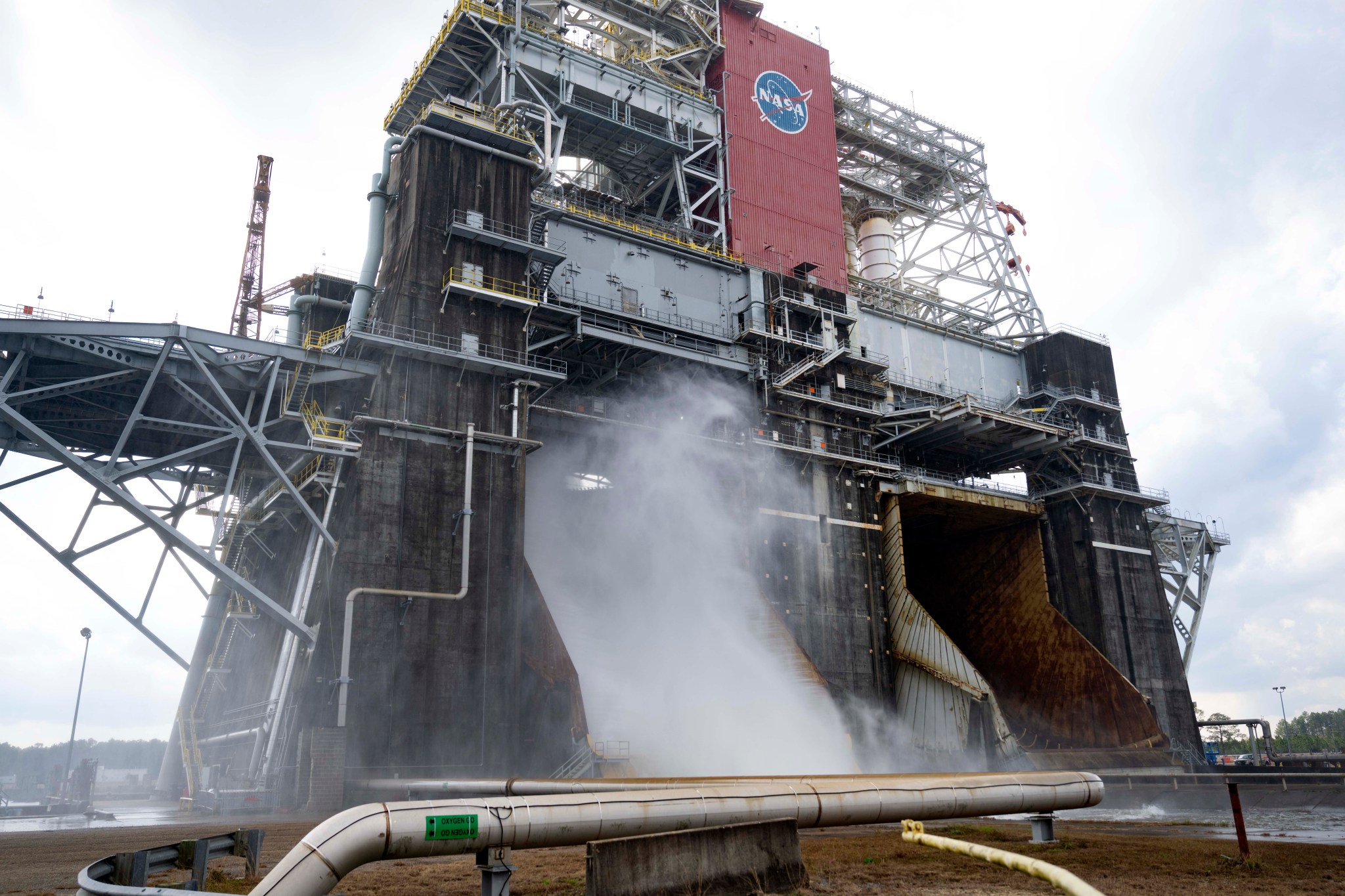 Water vapor escapes the Thad Cochran Test Stand as the new cooling systems are tested