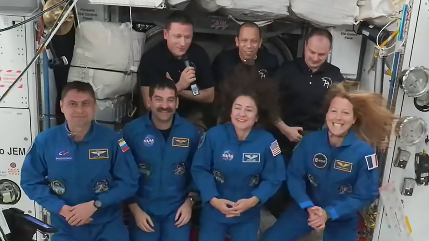Expedition 74 welcomes NASA's SpaceX Crew-12 members aboard the International Space Station. In the front from left are, Andrey Fedyaev of Roscosmos, Jack hatchway and Jessica Meir, both from NASA, and Sophie Adenot from ESA (European Space Agency). In the back are, Sergey Kud-Sverchkov of Roscosmos, Chris Williams of NASA, and Sergei Mikaev of Roscosmos.