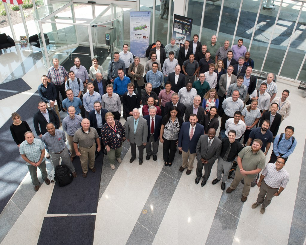 A group of people standing together and looking up at the camera.
