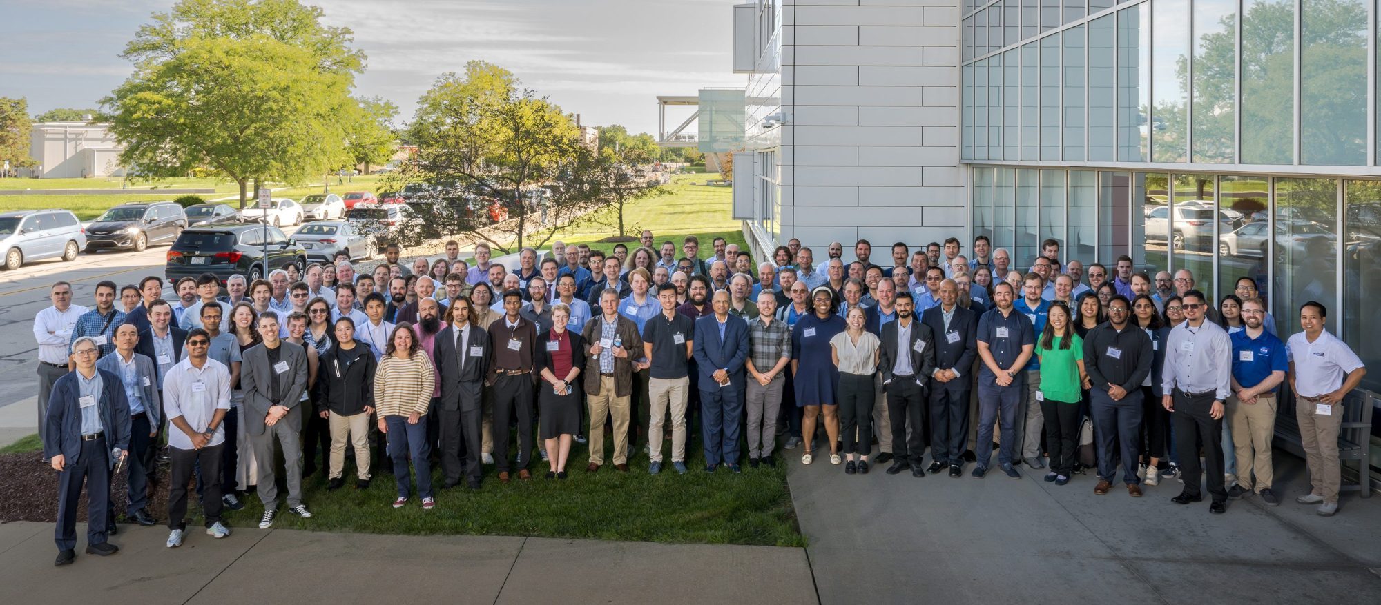 group of roughly 150 people posing at NASA GRC