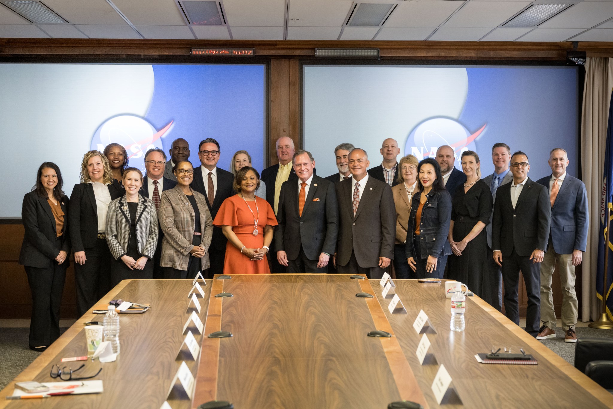 Johnson Center Director Vanessa Wyche and UT System Chancellor John Zerwas (center) stand with members of their respective leadership teams following the ceremonial agreement signing.