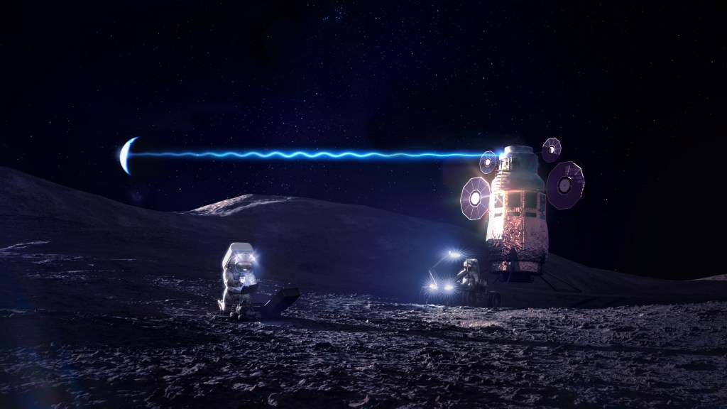 Alt text: Two astronauts are seen working on the dark gray rocky terrain of the Moon under a sea of stars. The astronaut on the left side of the image is kneeling while looking at a tablet device, and the astronaut on the right is driving a lunar terrain vehicle with bright headlights. A large gold and silver human landing system with four purple solar panels is seen standing in the distance behind the astronauts. A bright blue wavy beam of light, representing a communications signal, travels from the top of the human landing system to a dimly lit Earth resting just over the horizon. Two additional faint blue wavy beams of light are traveling from the landing system to the lunar surface, reflecting off the Moon's craterous terrain before connecting to Earth. 