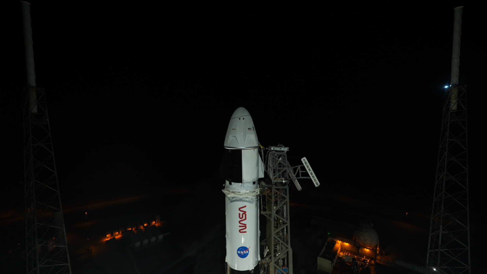A SpaceX Falcon 9 rocket with the company’s Dragon spacecraft on top stands vertical on the launch pad at Space Launch Complex 40 at Cape Canaveral Space Force Station in Florida on Friday, Feb. 13, 2026, ahead of NASA’s SpaceX Crew-12 launch.