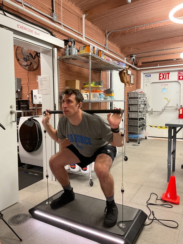 Crew Health and Performance Exploration Analog (CHAPEA) Mission 2 commander, Ross Elder, exercising in the habitat.