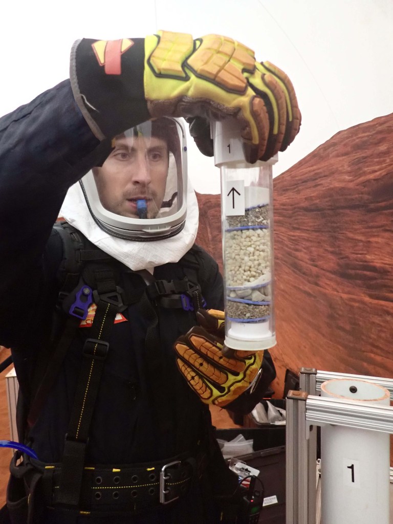 Ross Elder, Crew Health and Performance Exploration Analog (CHAPEA) Mission 2 commander, participates in an extravehicular geological activity.