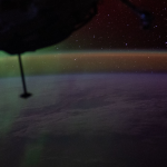 A wispy green aurora australis fades into a dim orange-yellow airglow above Earth’s horizon in this photograph taken at approximately 2:31 a.m. local time from the International Space Station, as it orbited 270 miles above the Indian Ocean, south of Perth, Australia.