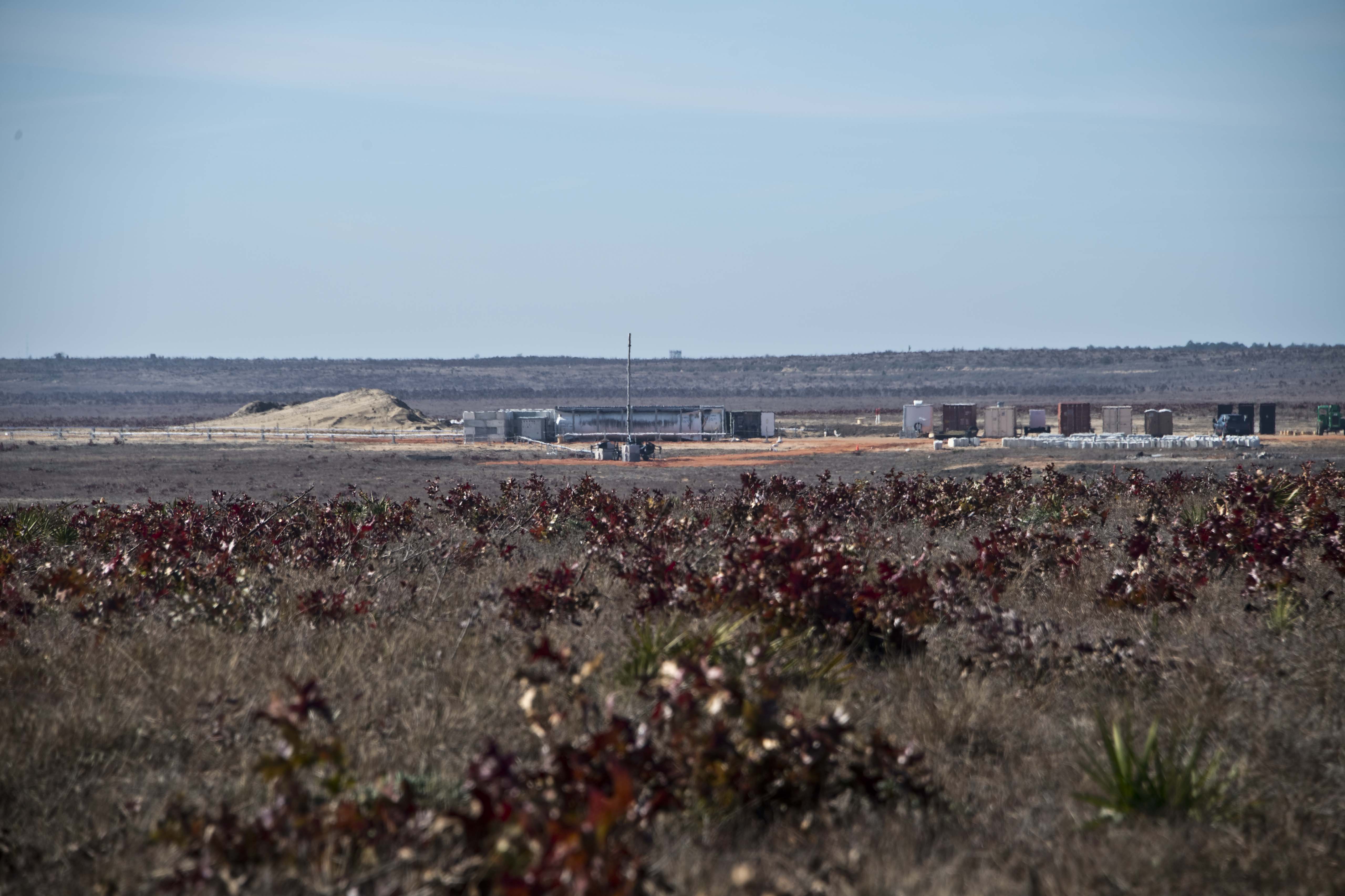 Portable flare stack burning off excess gas at the rocket propellant test site.