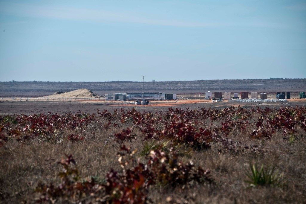 Portable flare stack burning off excess gas at the rocket propellant test site.