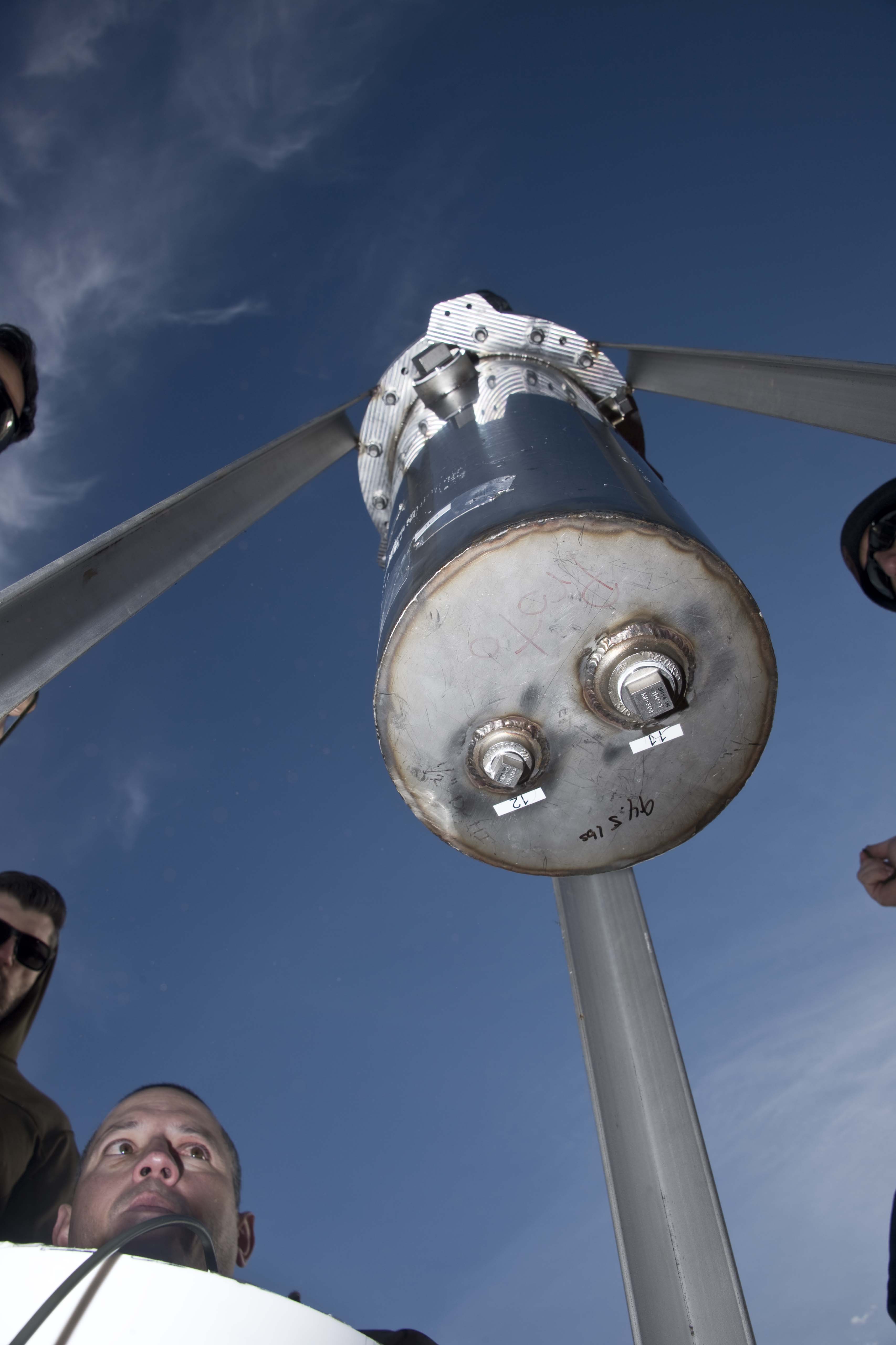 Team members preparing to install C-4 beneath the test article for the second baseline test.