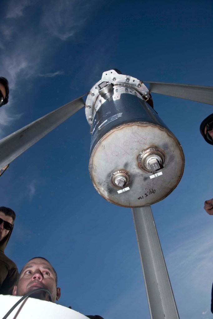 Team members preparing to install C-4 beneath the test article for the second baseline test.