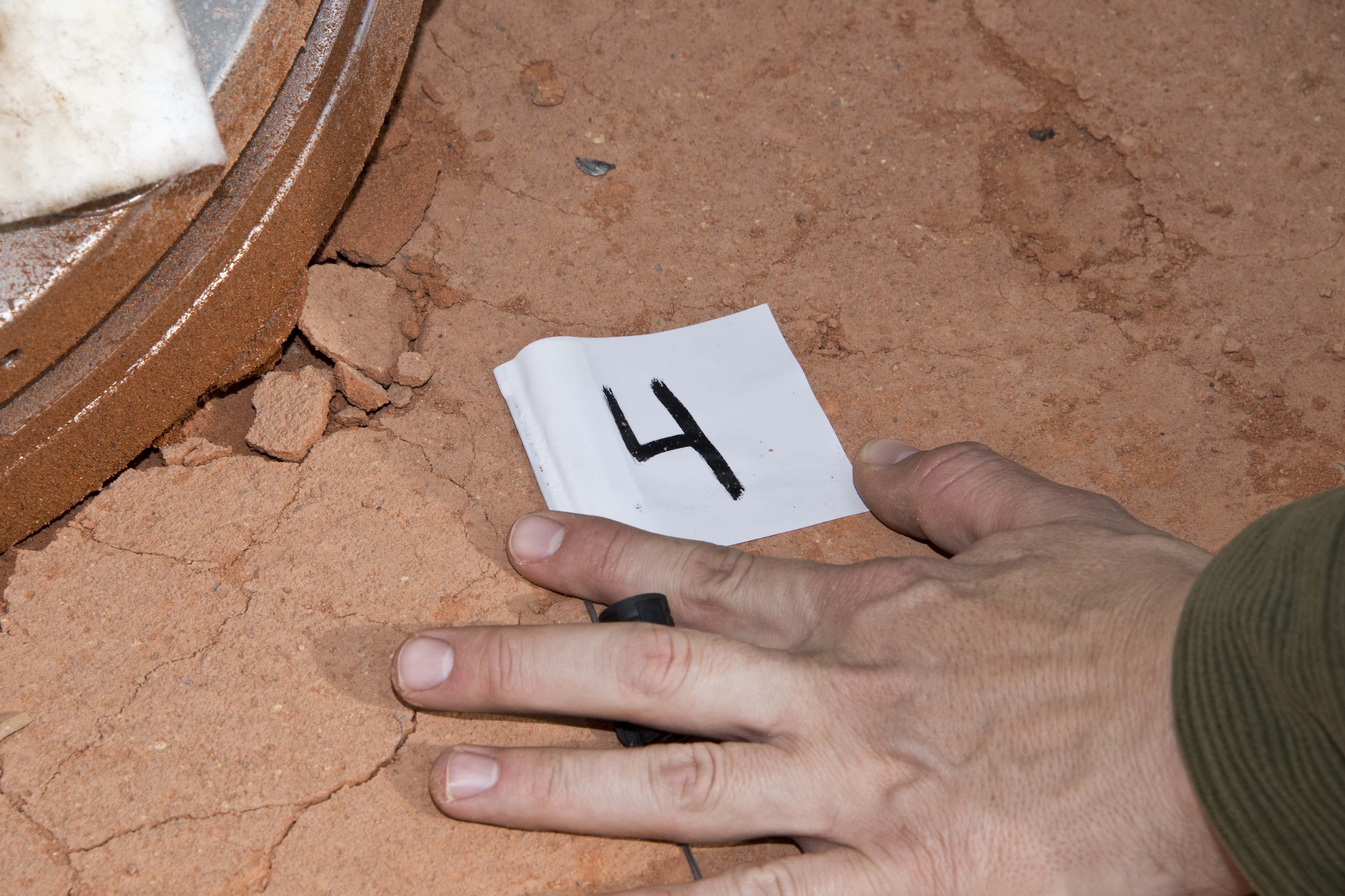 Personnel record upper tank impact point using GPS.