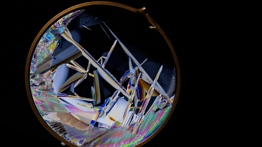 Colorful ice crystal wafers captured using a simple laptop light, filter, and a space station freezer.