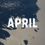 Lake Michigan beams in the afternoon sunlight as clouds blanket its southern tip—spanning Michigan, Indiana, and Illinois—in this photograph taken from the International Space Station while orbiting 263 miles above Earth. The northern tip of Lake Huron is visible at left.