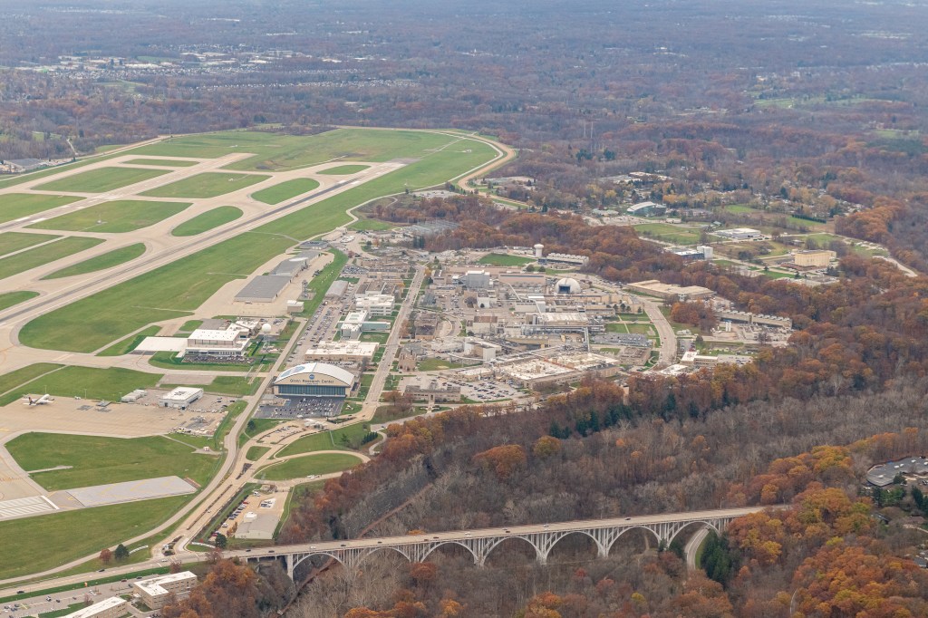 An aerial view of NASA Glenn Research Center in late autumn. To the left of NASA is the Cleveland Hopkins International Airport runways. In the foreground the Brookpark Rd. bridge.