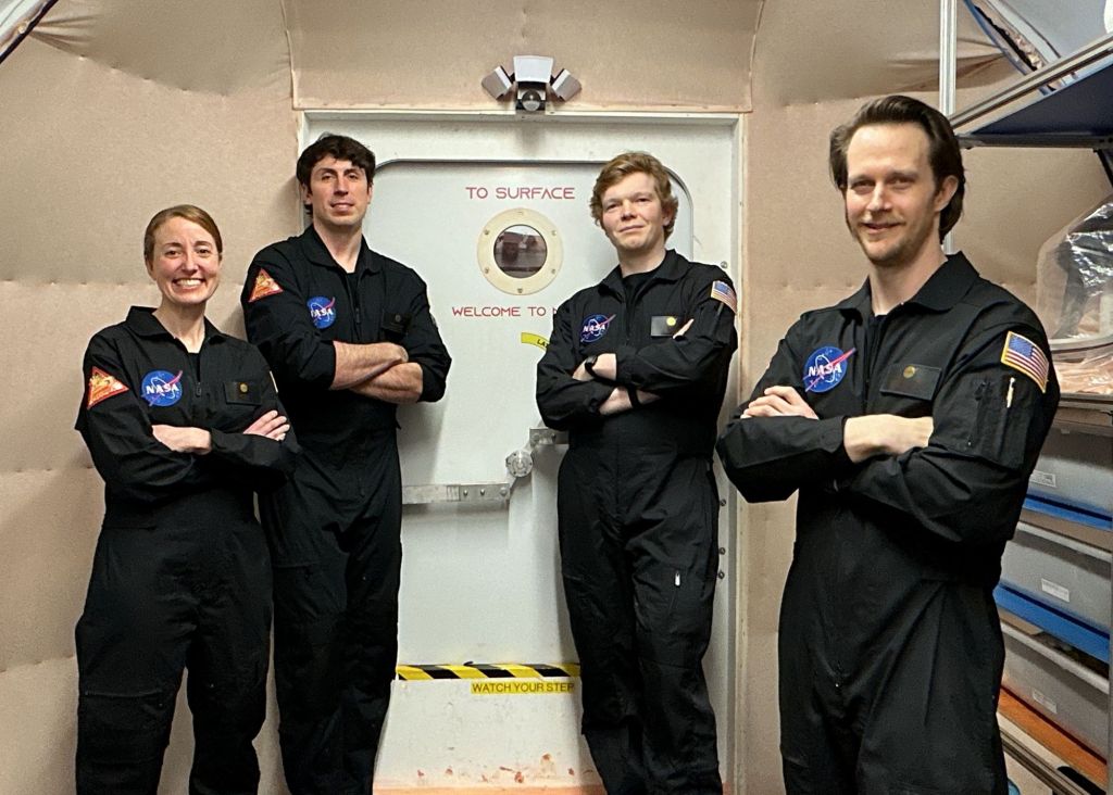 Members of NASA’s CHAPEA (Crew Health and Performance Exploration Analog) mission 2 pose for a group photo. (From left to right: Ellen Ellis, Ross Elder, James Spicer, and Matthew Montgomery).