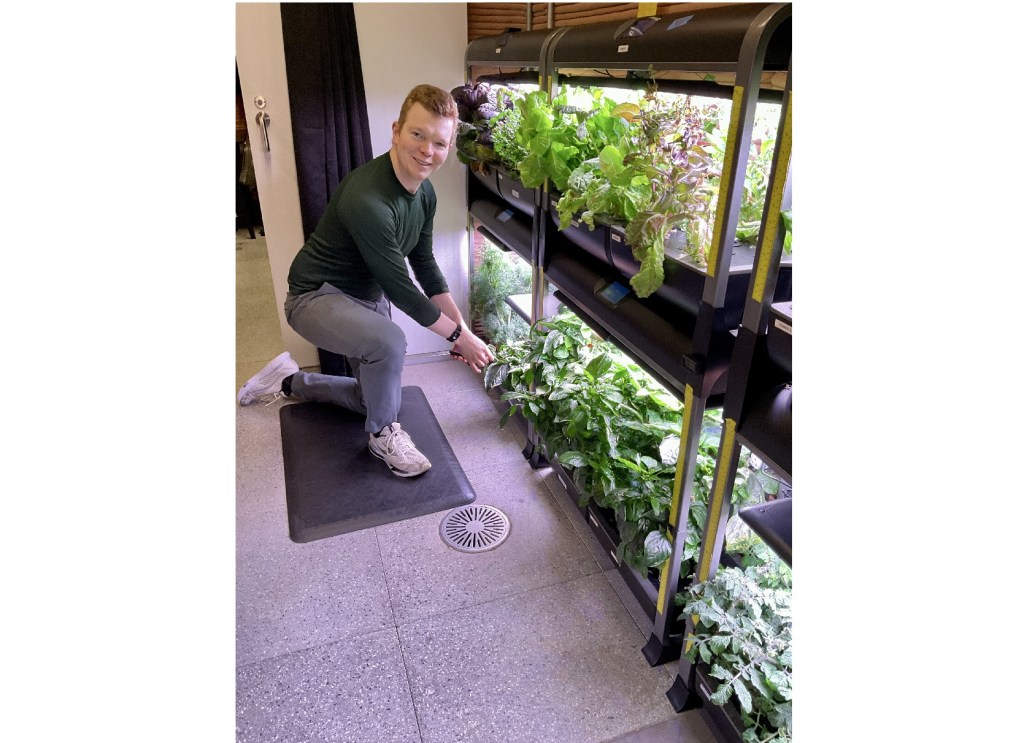James Spicer, Crew Health and Performance Exploration Analog (CHAPEA) Mission 2 flight engineer, tends to crops grown in the habitat’s hydroponic crop system.