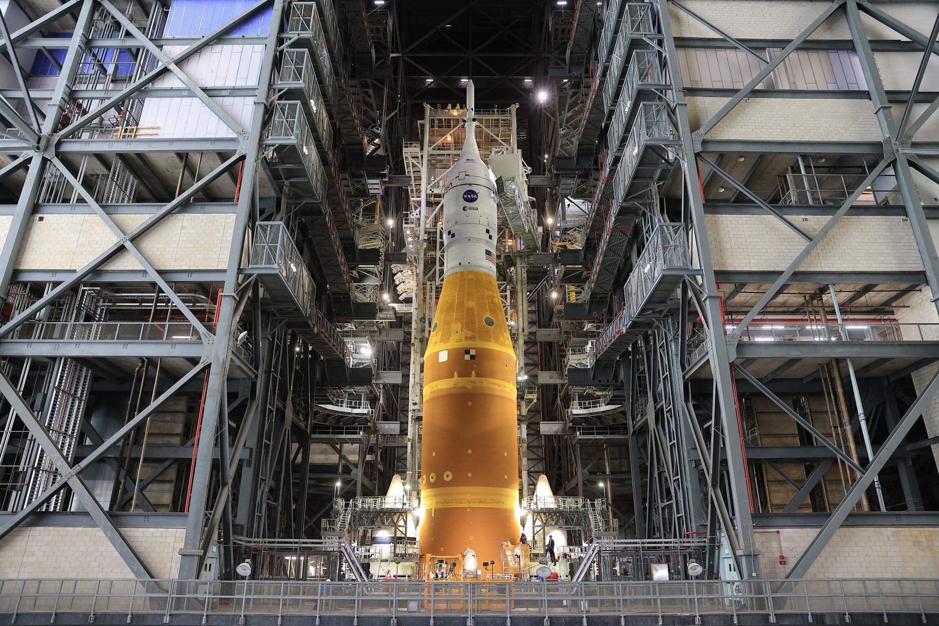 NASA’s Artemis II SLS (Space Launch System) rocket and Orion spacecraft, secured to the mobile launcher, stands vertical inside the Vehicle Assembly building on Tuesday, March 17, 2026, as preparations continue for rollout to Launch Complex 39B at NASA’s Kennedy Space Center in Florida. The Artemis II test flight will take Commander Reid Wiseman, Pilot Victor Glover, and Mission Specialist Christina Koch from NASA, and Mission Specialist Jeremy Hansen from the CSA (Canadian Space Agency), around the Moon and back to Earth with launch opportunities beginning in April 2026.