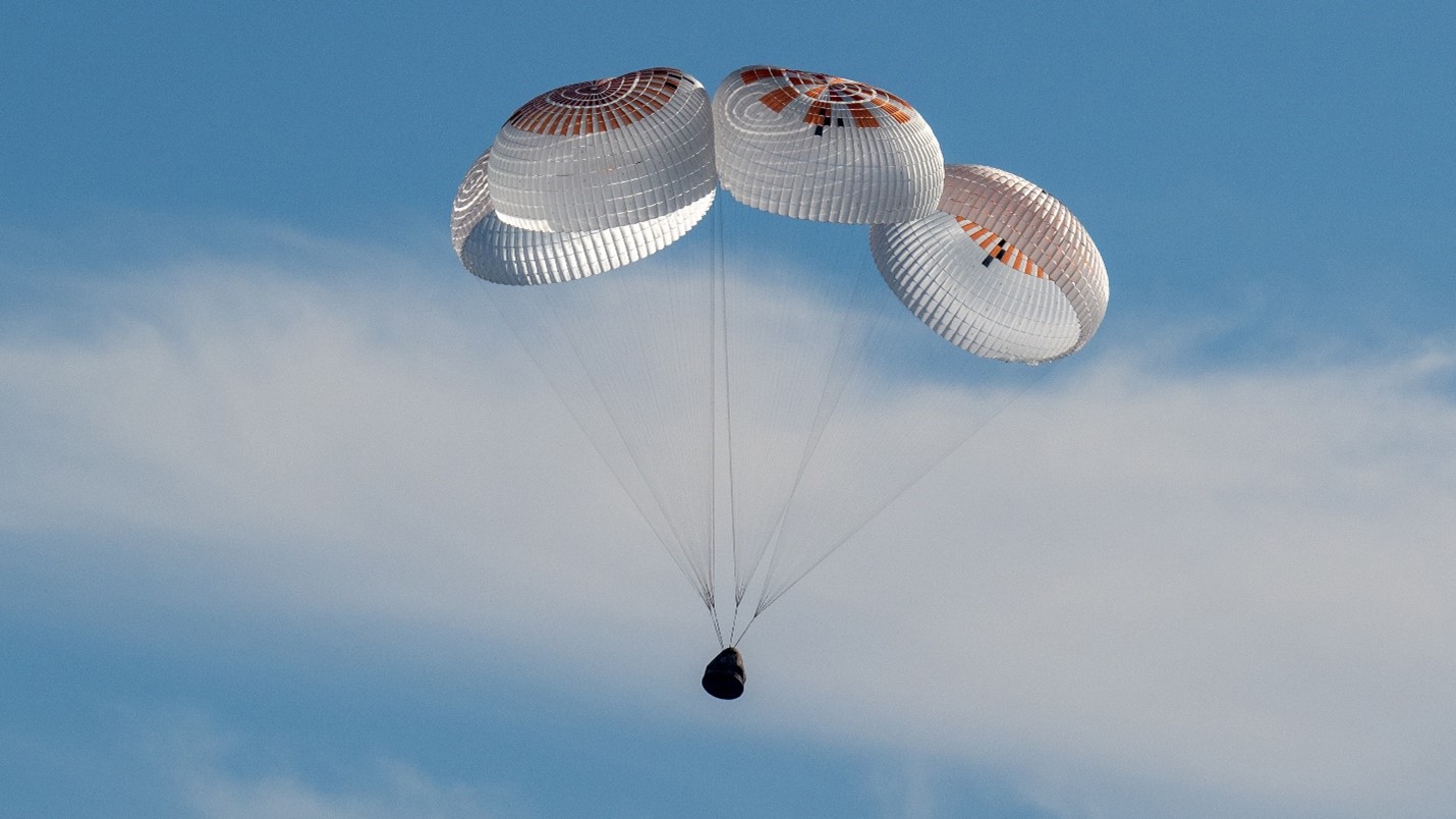 Spacecraft returning to earth, slowed down by