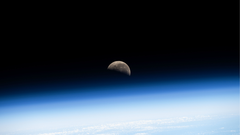 The Last Quarter Moon is pictured above Earth's atmosphere from the International Space Station as it soared 260 miles over the Pacific Ocean southwest of Panama on the Latin American continent.
