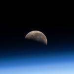 The Last Quarter Moon is pictured above Earth's atmosphere from the International Space Station as it soared 260 miles over the Pacific Ocean southwest of Panama on the Latin American continent.