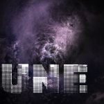 Lightening is shown flashing through wispy storm clouds off the coast of North Carolina while the crew was orbiting 260 miles (418 kilometers) above the Atlantic Ocean. The hue of the clouds is a mix of lighter and darker purples. The clouds appear to be funneling in towards a brighter mass of clouds in the center.