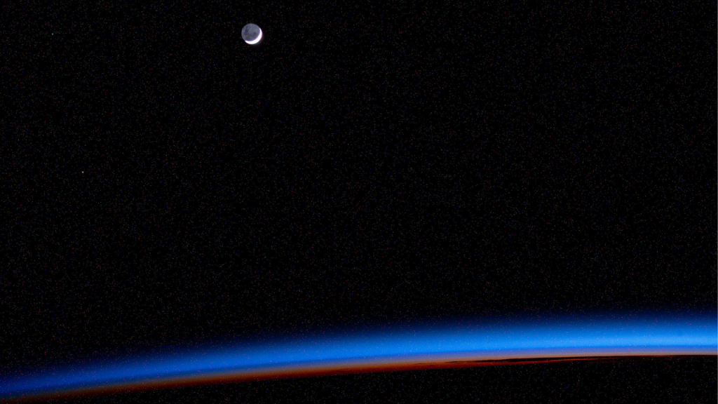 An external high-definition camera adjusted for night sensitivity took this photograph of the waning crescent Moon above Earth's horizon as the International Space Station orbited into a sunrise 270 miles above the Atlantic Ocean.