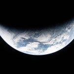 art002e023072 (April 2, 2026) - A sliver of Earth is illuminated against the blackness of space in this photo taken by an Artemis II crew member through an Orion spacecraft window on the second day of the mission. Credit: NASA