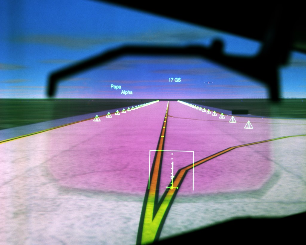 Display showing computer graphics of aircraft runway.