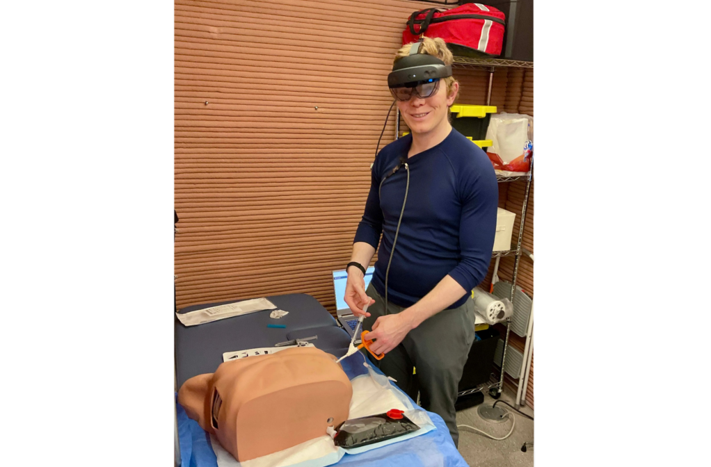 James Spicer, Crew Health and Performance Exploration Analog (CHAPEA) Mission 2 flight engineer, performing a demonstration of Artificial Intelligence-enabled medical training.