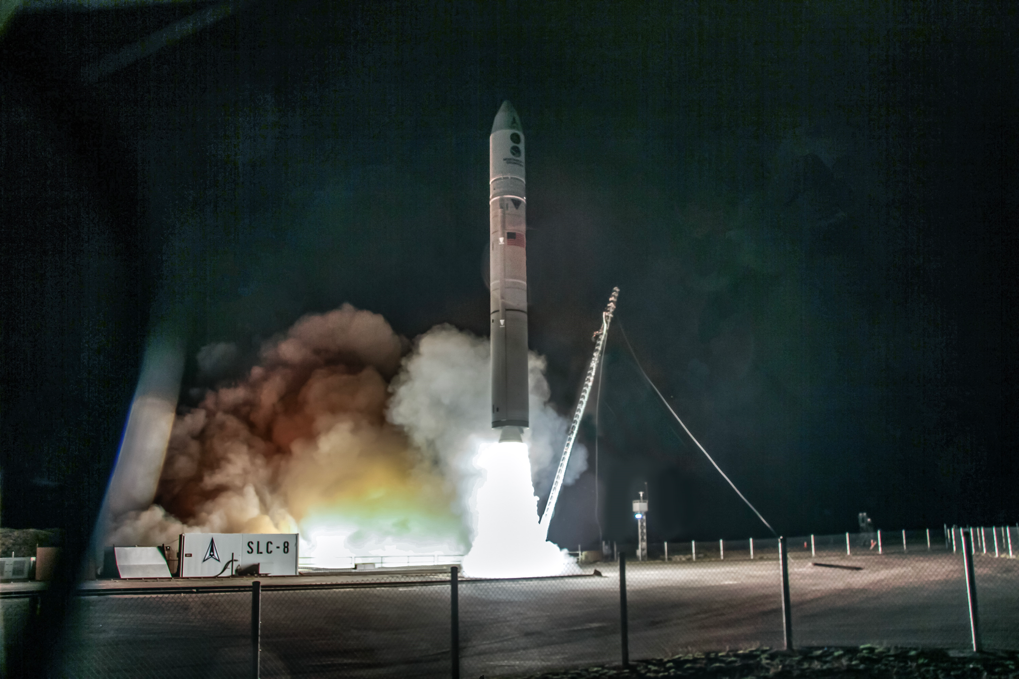 Rocket lifting off at night