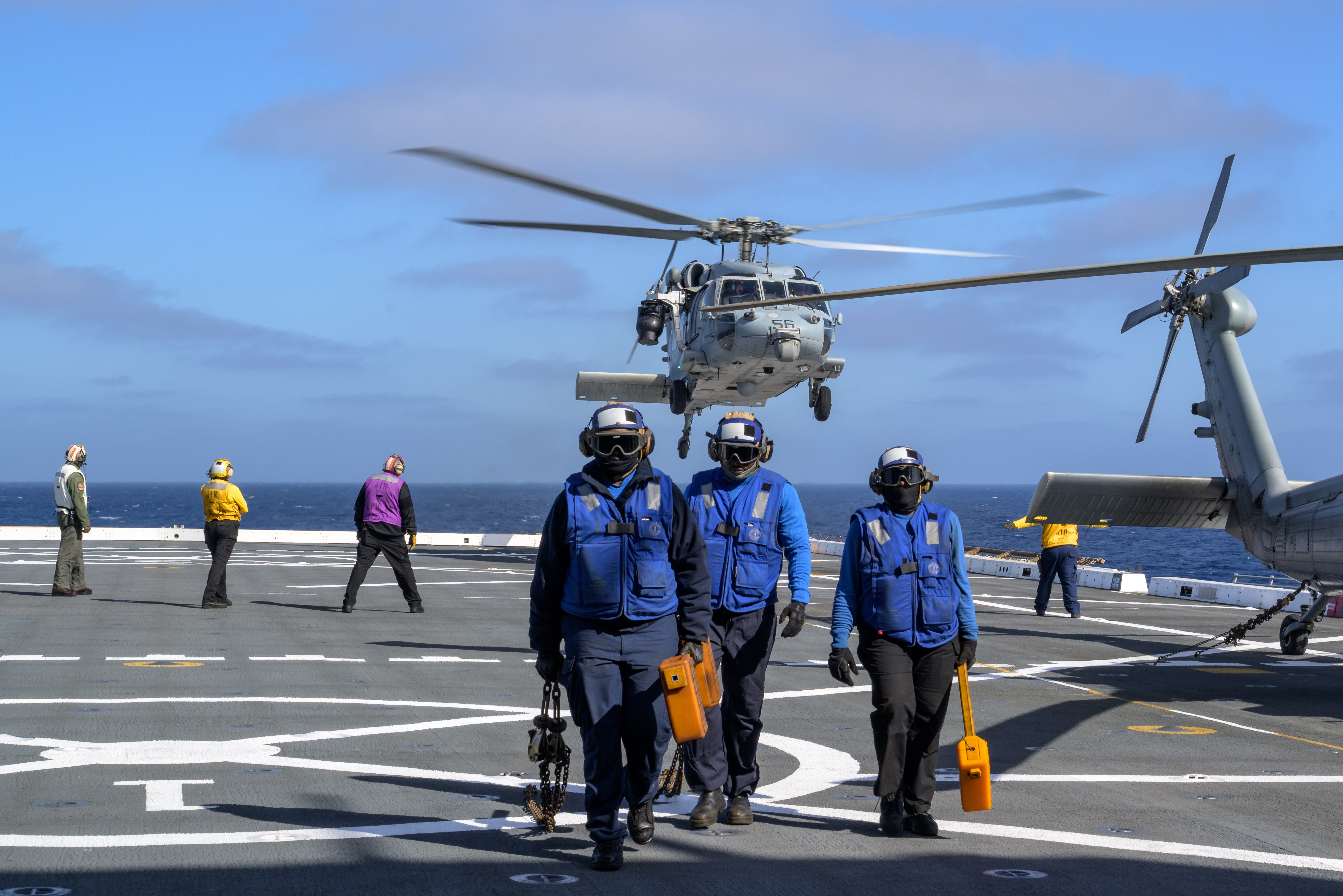 U.S. Navy MH-60 Seahawks from Helicopter Sea Combat Squadron (HSC) 23 depart USS John P. Murtha as they conduct air...