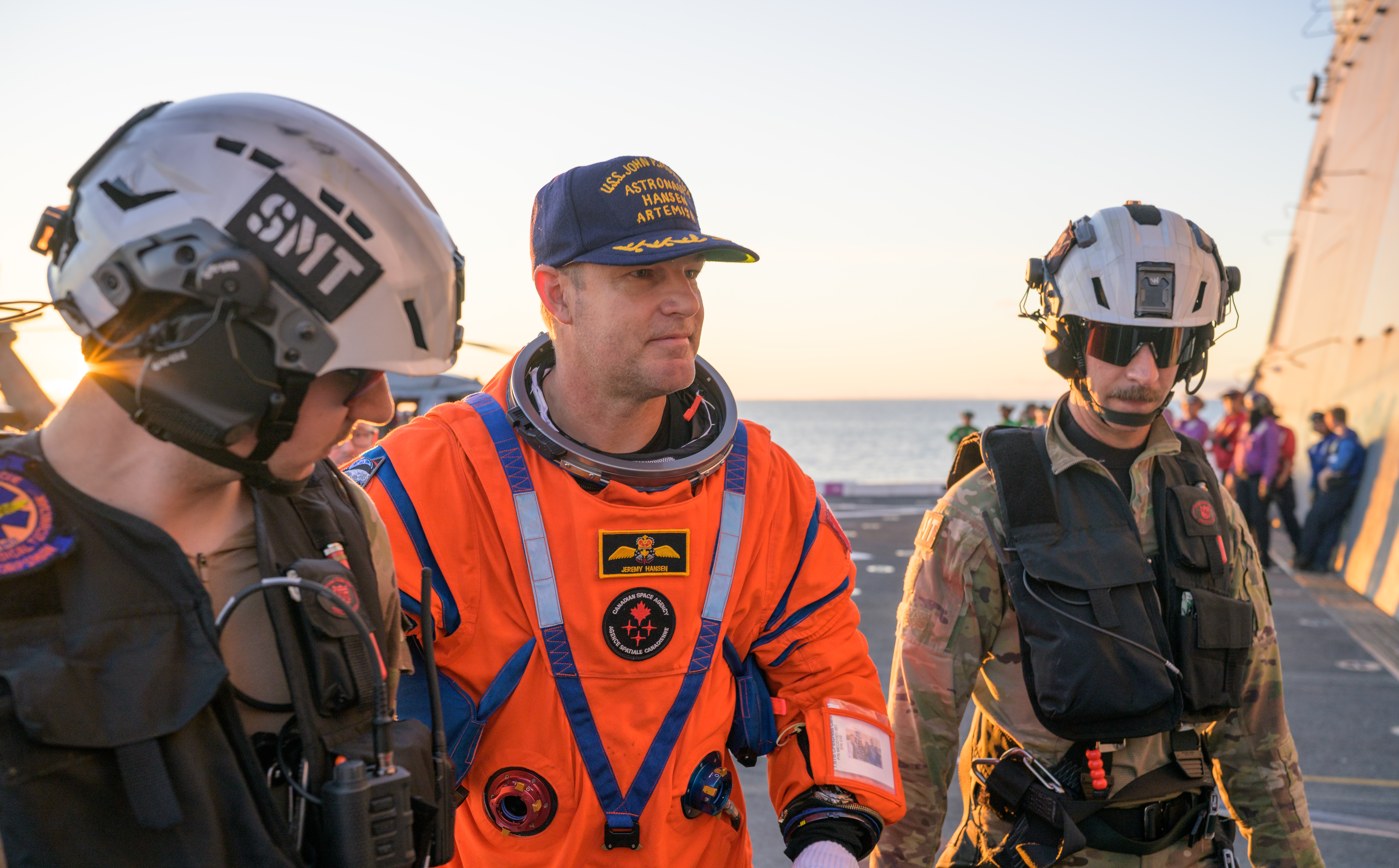CSA (Canadian Space Agency) astronaut Jeremy Hansen, Artemis II mission specialist is assisted off the flight deck after arriving aboard...