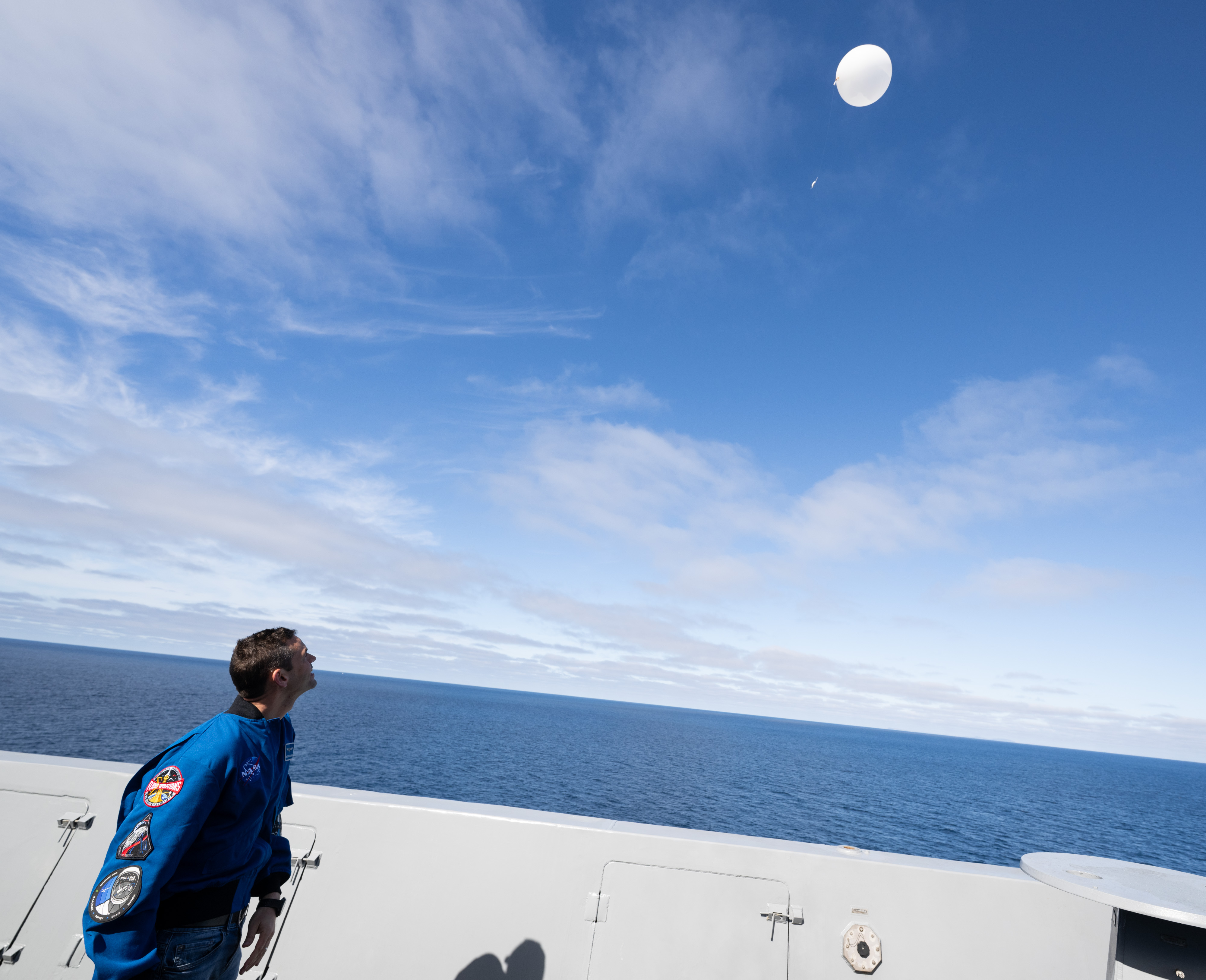 NASA Administrator Jared Isaacman launches a weather balloon for the 45th Weather Squadron from USS John P. Murtha as NASA...